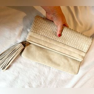 Cream lattice clutch with tassel